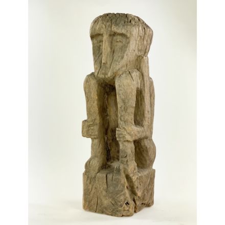 African sculpture of a sitting man
